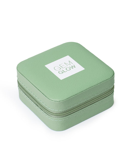 The GEM GLOW Jewelry Storage Case closed with secure zipper, showcasing its convenient compact size.