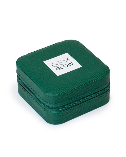 The GEM GLOW Jewelry Travel Case closed with secure zipper, showcasing its sleek, compact size for travel.