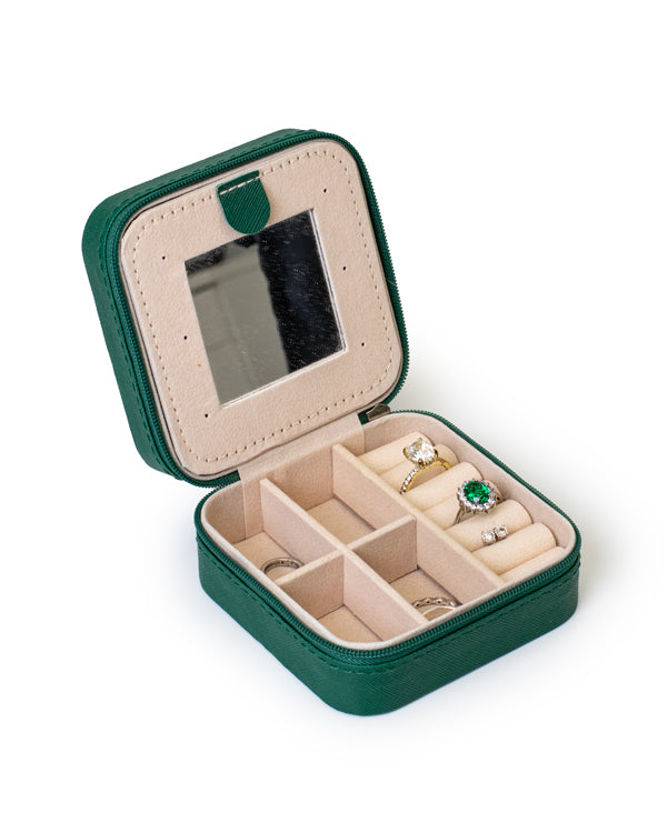 The GEM GLOW Jewelry Travel Case open with rings and earrings safely separated in different compartments for easy travel.