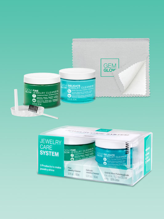 Outer packaging of the GEM GLOW Jewelry Care System, and the products included unpackaged.