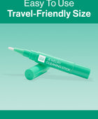 The GEM GLOW Jewelry Cleaning Stick propped up by its cap, showcasing the brush head and its easy-to-use, travel-friendly size.