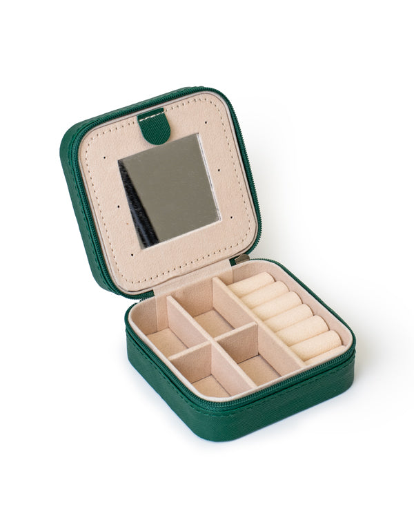The GEM GLOW Jewelry Travel Case open, showing three sections with compartments that separate jewelry and a built-in mirror.