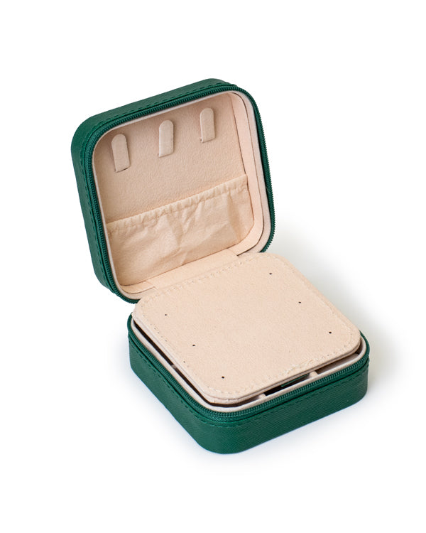 The GEM GLOW Jewelry Storage Case open with the built-in mirror partition down, revealing three hooks and a pocket for storage.