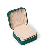 The GEM GLOW Jewelry Storage Case open with the built-in mirror partition down, revealing three hooks and a pocket for storage.
