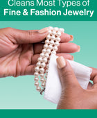 Hands using a Gem Glow Jewelry + Watch Cleansing Wipe to clean a pearl bracelet.