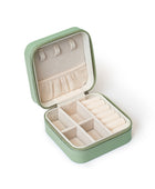 The GEM GLOW Jewelry Storage Case open, displaying three sections with different compartments that safely separate jewelry.