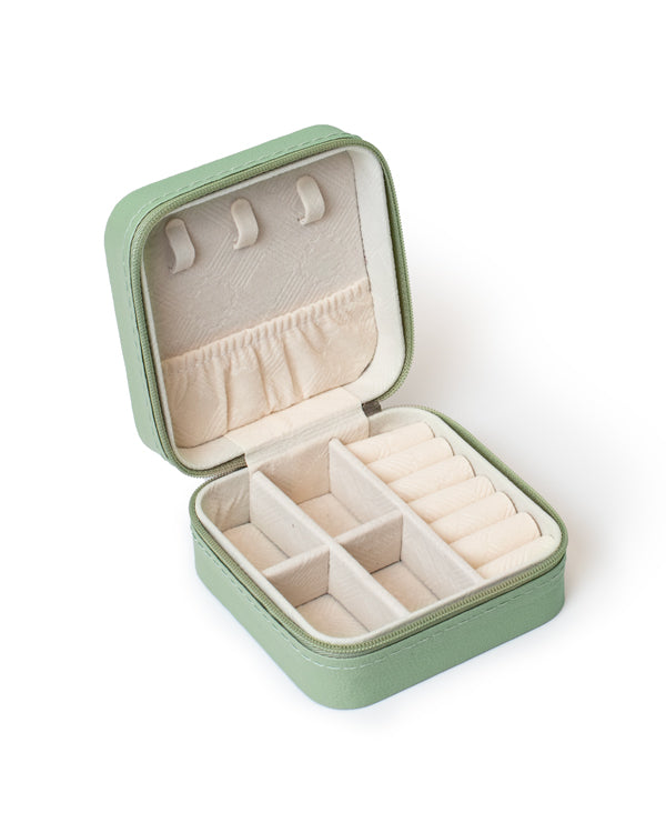 The GEM GLOW Jewelry Storage Case open, displaying three sections with different compartments that safely separate jewelry.