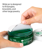 Hands opening a jar of Fine Jewelry Cleaner