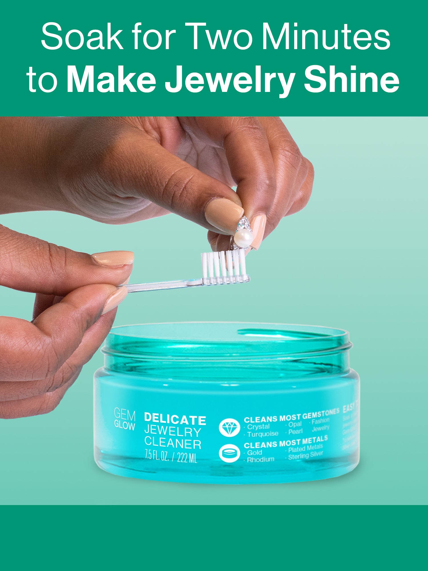 Hands using the included touch-up brush to clean a pearl ring after soaking in the GEM GLOW 7.5 oz. Delicate Jewelry Cleaner.