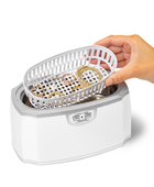 Hand holding accessory basket dipping it into the Professional Ultrasonic Machine